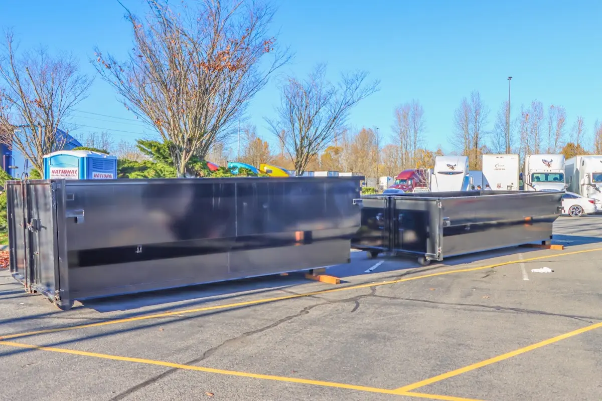 Professional dumpster rental service with roll-off container on residential driveway in Cornelius
